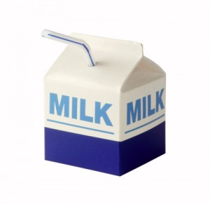 Milk carton with straw on white